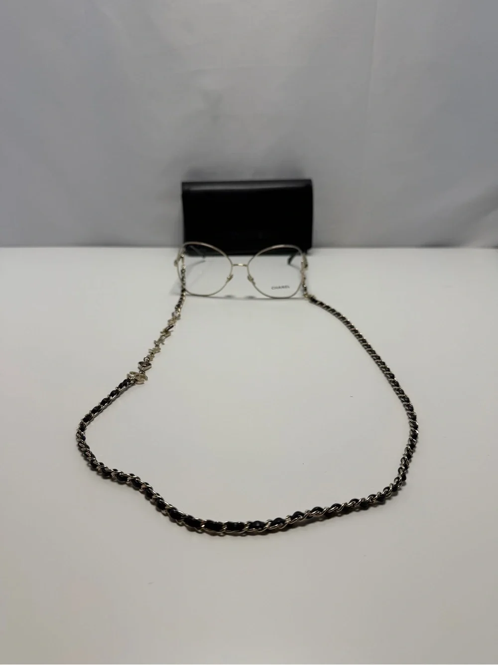 CHANEL  Gold and Black Eye ear Chain with Silver-Tone Glasses